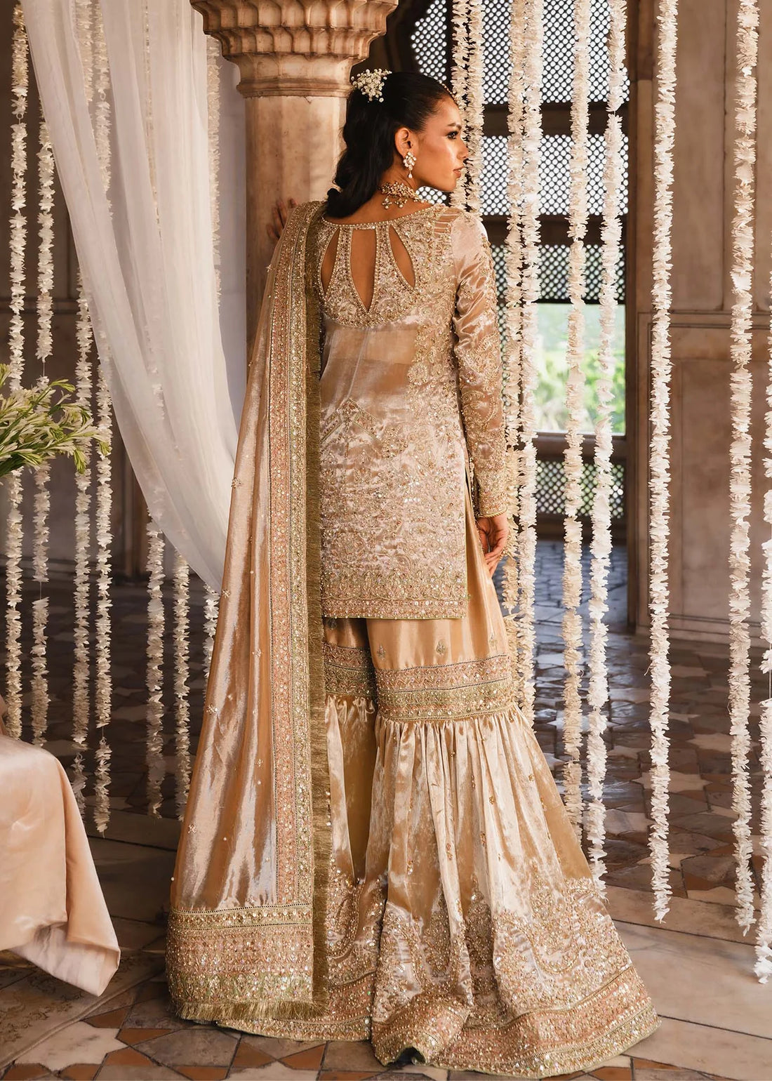 RESHAM – Gold bridal gharara suit in tissue with embroidery and dupatta. Stitched Pakistani wedding outfit online at Pakistanimoda.