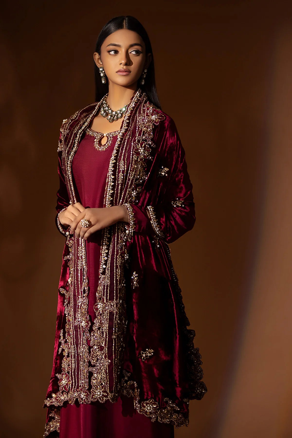 Maroon velvet shawl with full hand embellishments of naqshi, dabka, pearls & gota – perfect for Pakistani brides and formal winter occasions 2025.