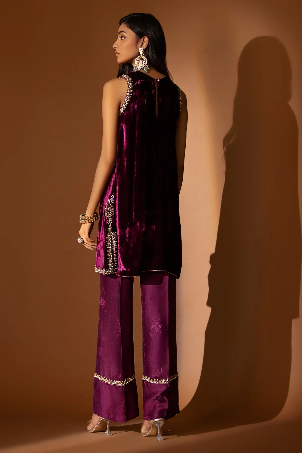 Plum velvet shirt with hand-embellished neckline, paired with embossed silk pants and a matching lace-trimmed organza dupatta for formal winter wear.