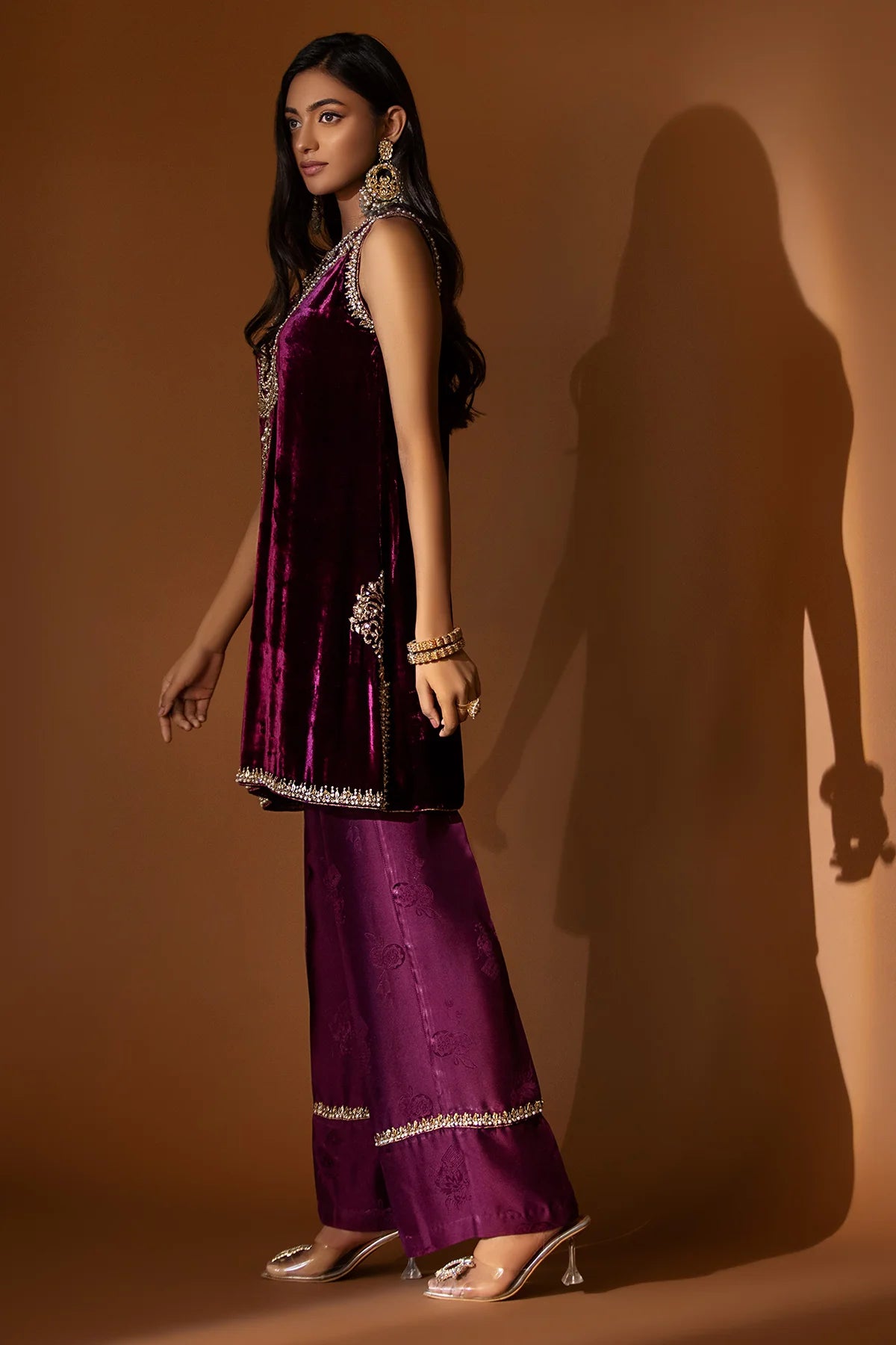 Plum velvet shirt with hand-embellished neckline, paired with embossed silk pants and a matching lace-trimmed organza dupatta for formal winter wear.