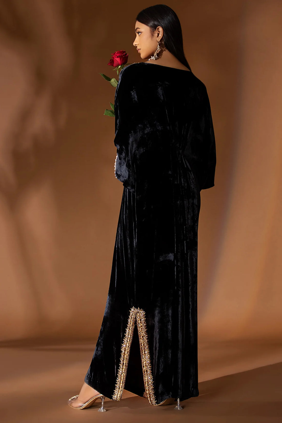 Black velvet kaftan with matching gold jamawar pants for formal wear