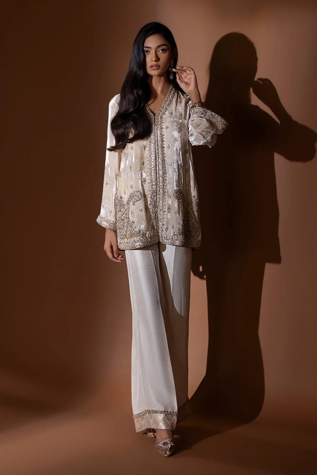 Beige velvet jacket with silver gold handwork and jamawar finish, paired with raw silk blouse, pants, and matching organza dupatta – formal wear 2025.