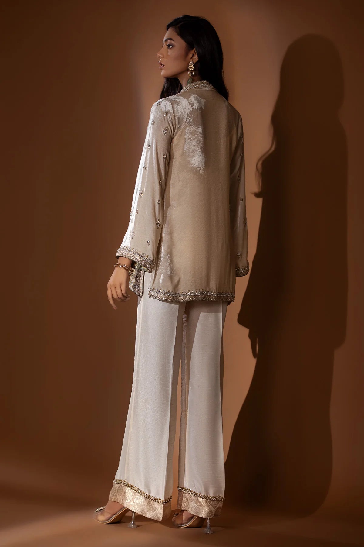 Beige velvet jacket with silver gold handwork and jamawar finish, paired with raw silk blouse, pants, and matching organza dupatta – formal wear 2025.