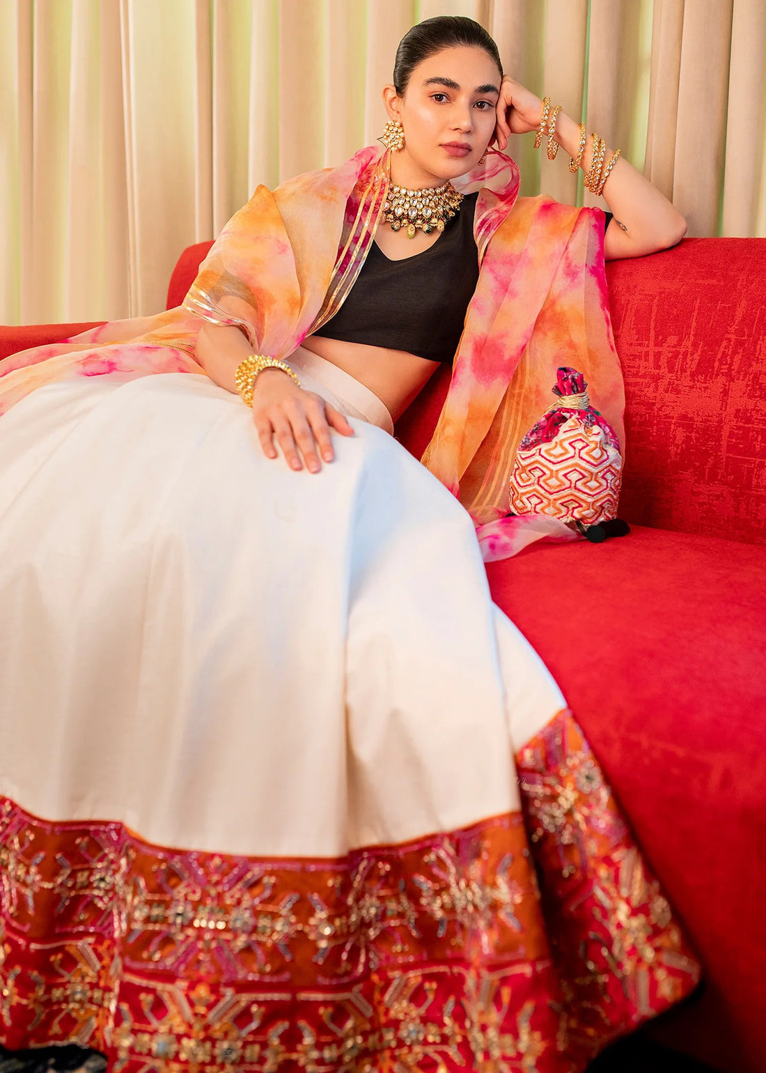 Black and white raw silk Pakistani lehenga choli with mirror, pitta, and sequin embellishments, paired with black choli and tie-dye dupatta – ideal for receptions and formal events.