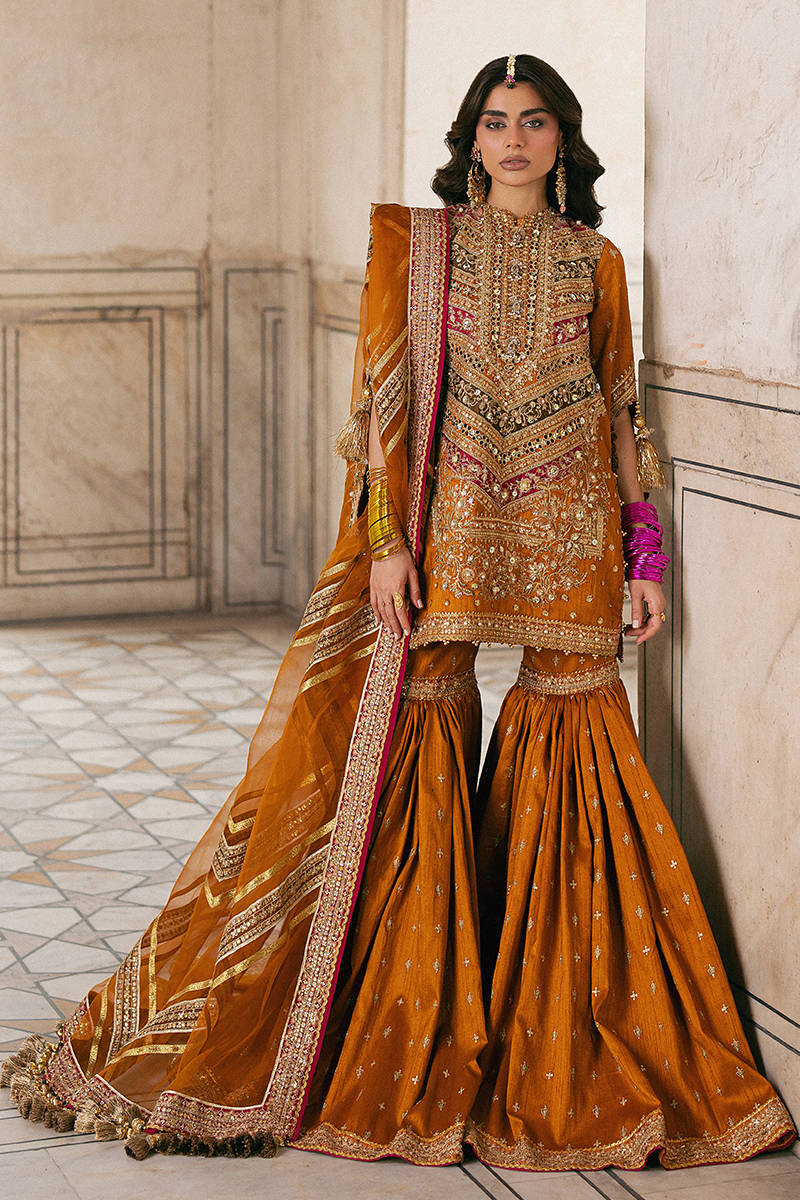 Ranjish MNR orange heavy embroidered raw silk gharara set with organza dupatta, stitched and available at Pakistanimoda for Canada events.