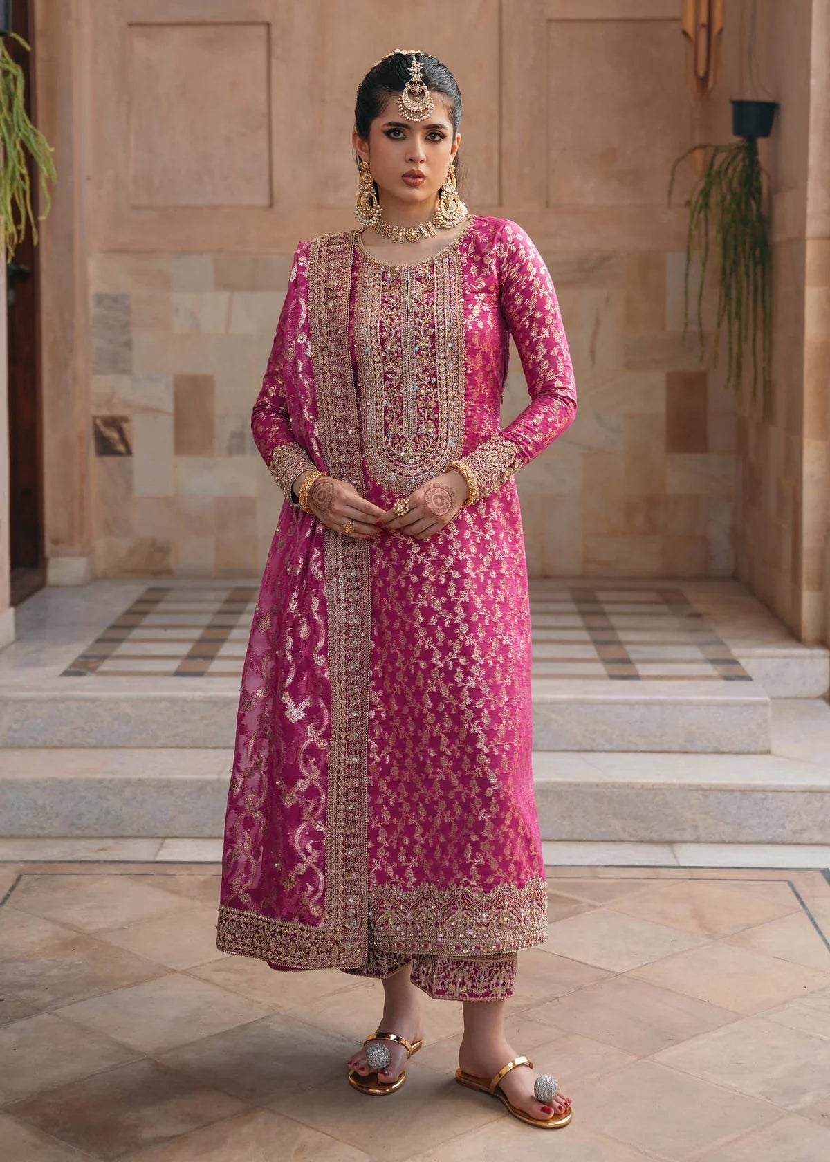 Rano shocking pink badla embroidered suit with hand-embroidered neckline, silk pants with gota lace, and dupatta by Kanwal Malik for dholki and mehndi wear.