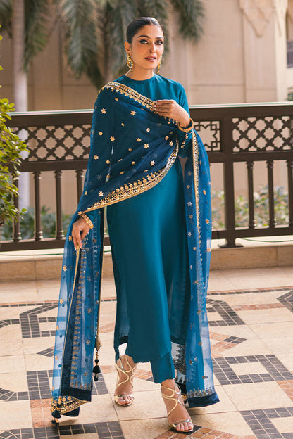 Sapphire blue Pakistani silk dress with back handwork buttons, churidar pants, and a gota embellished dupatta – ideal for weddings and formal events.