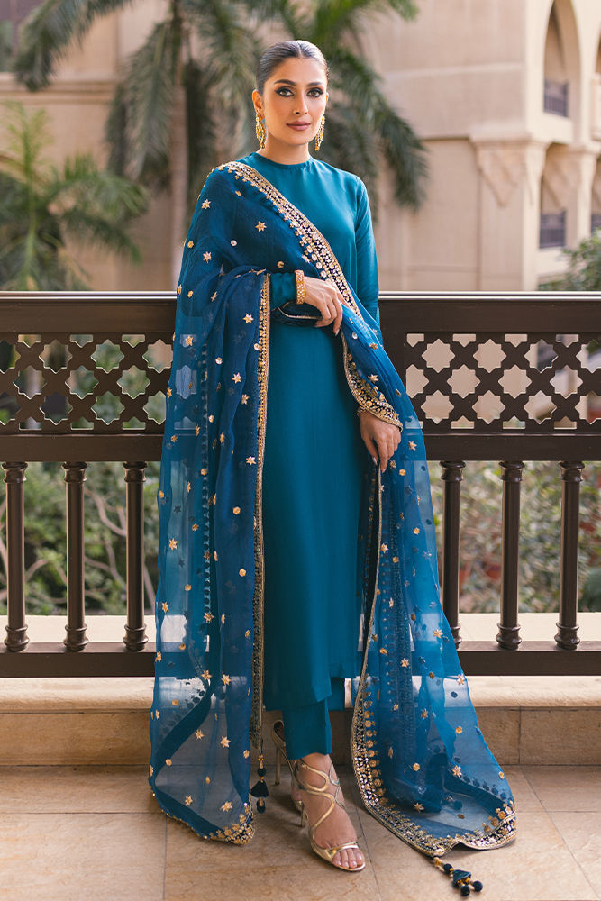 Sapphire blue Pakistani silk dress with back handwork buttons, churidar pants, and a gota embellished dupatta – ideal for weddings and formal events.