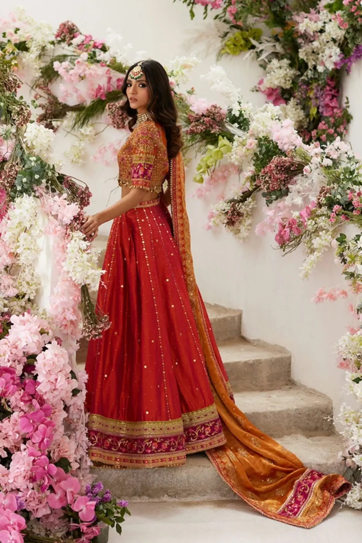 Reya Orange Crystal Embellished Silk Net Wedding Lehenga Choli with Zardozi Handwork, Lame Tissue Dupatta and Matching Pouch