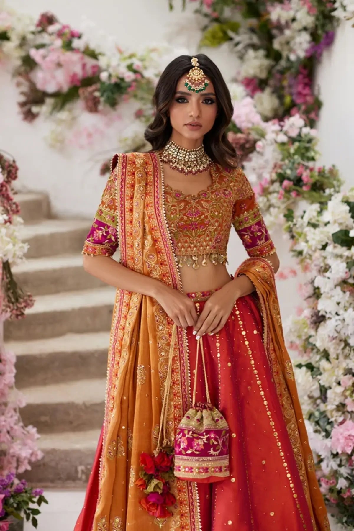 Reya Orange Crystal Embellished Silk Net Wedding Lehenga Choli with Zardozi Handwork, Lame Tissue Dupatta and Matching Pouch