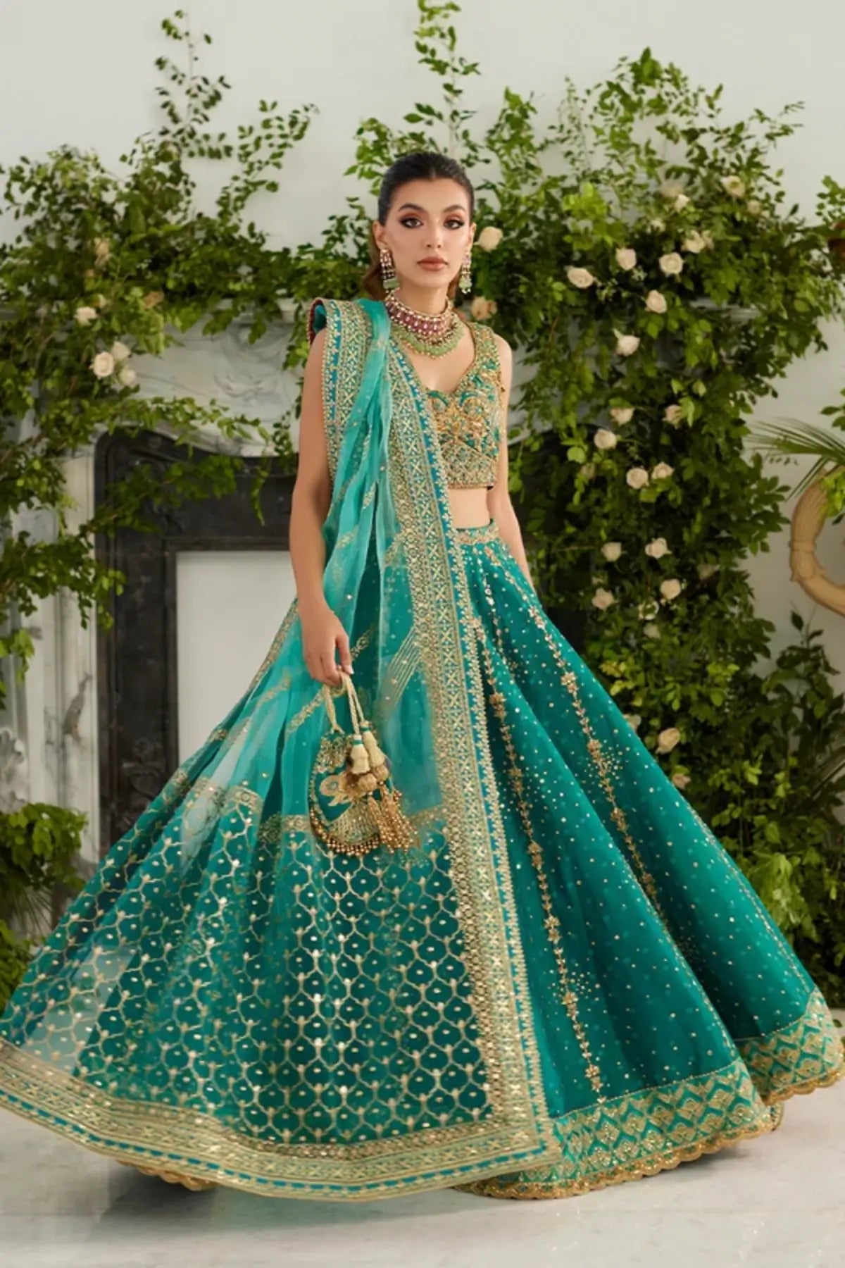Reyna Teal Gold Embroidered Silk Net Lehenga Choli with Ornate Borders, Contrasting Chunri Dupatta and Embellished Pouch