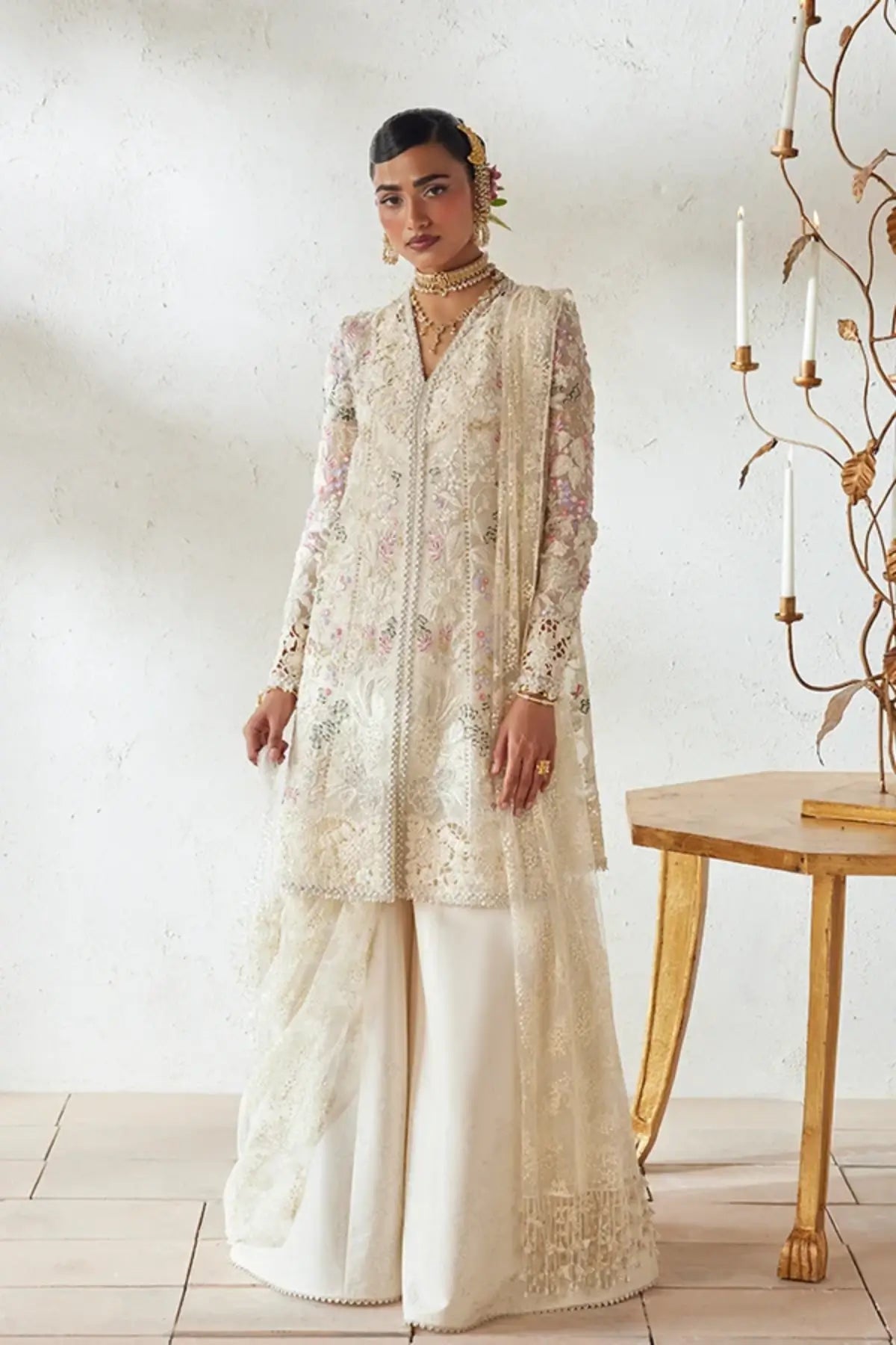 Rosha cloud white embroidered organza peplum sharara suit with multicolor floral resham work, raw silk sharara and embellished dupatta