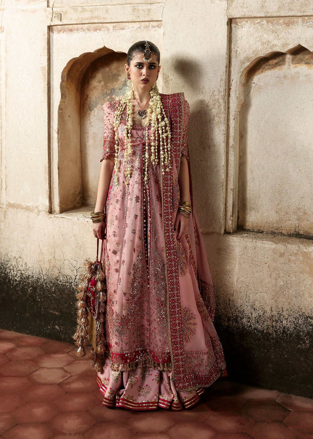 Model wearing Roshanara Rose Pink Organza Embroidered Pishwas with Lehenga and Chiffon Dupatta – Hussain Rehar Massarat Festive 2025 Collection.