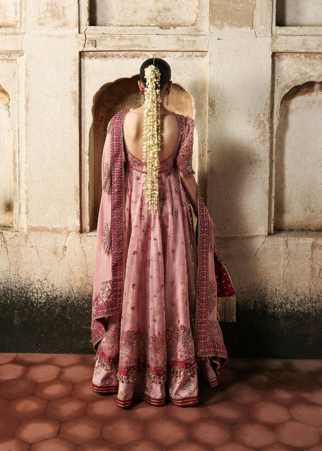 Model wearing Roshanara Rose Pink Organza Embroidered Pishwas with Lehenga and Chiffon Dupatta – Hussain Rehar Massarat Festive 2025 Collection.
