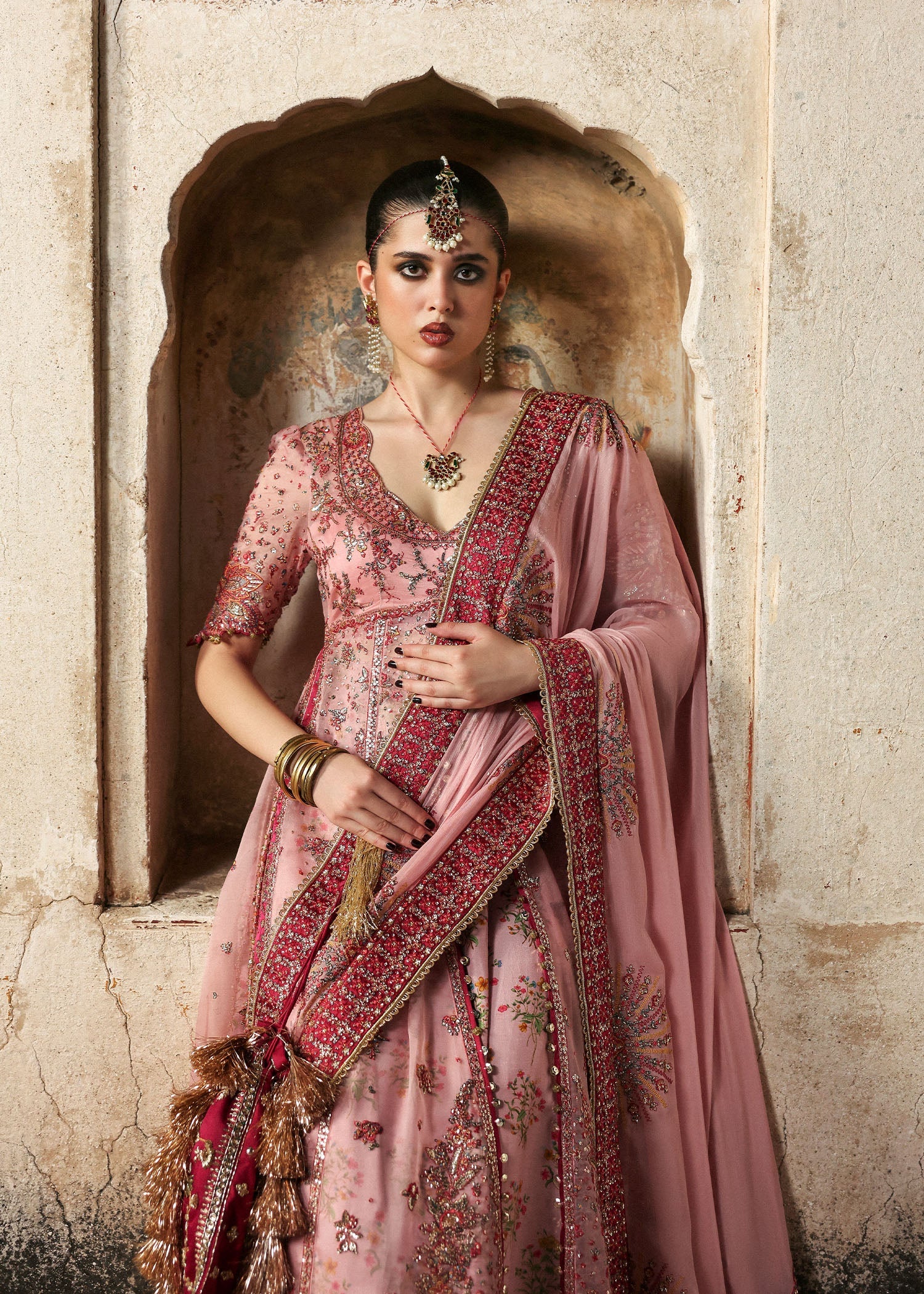 Model wearing Roshanara Rose Pink Organza Embroidered Pishwas with Lehenga and Chiffon Dupatta – Hussain Rehar Massarat Festive 2025 Collection.
