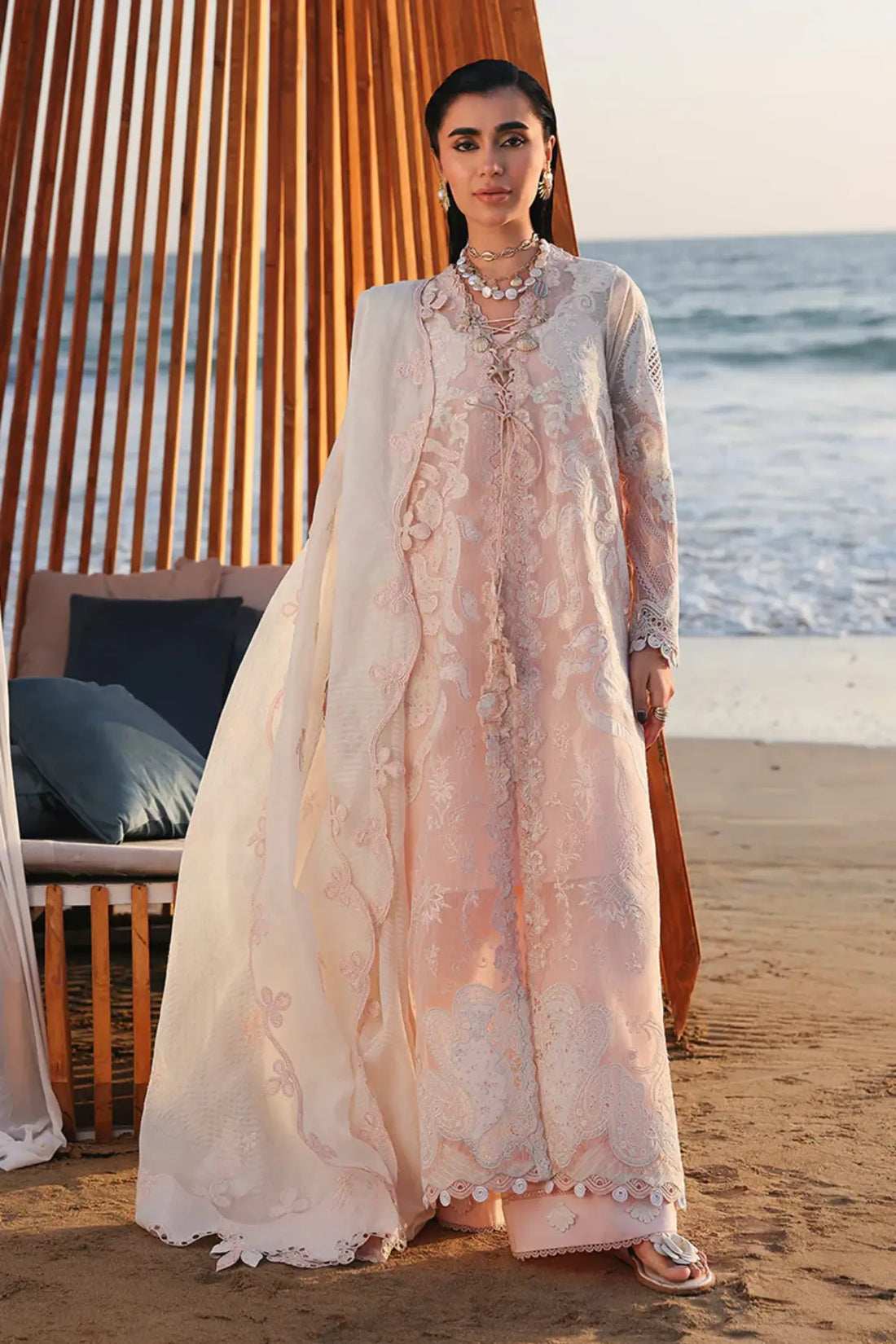 Peach stitched jacquard 3PC suit SA-06 Mahur featuring laser cut panels and detailed dupatta by Qalamkar.