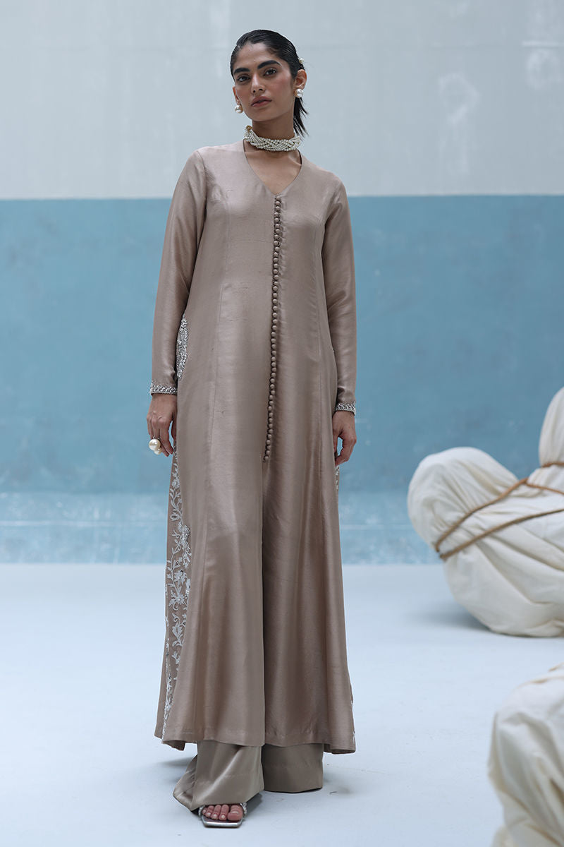 Ivory raw silk front-open embroidered shirt with pearls and cutdana, paired with shimmer crepe beige culottes – Pakistani formal outfit for weddings and events.