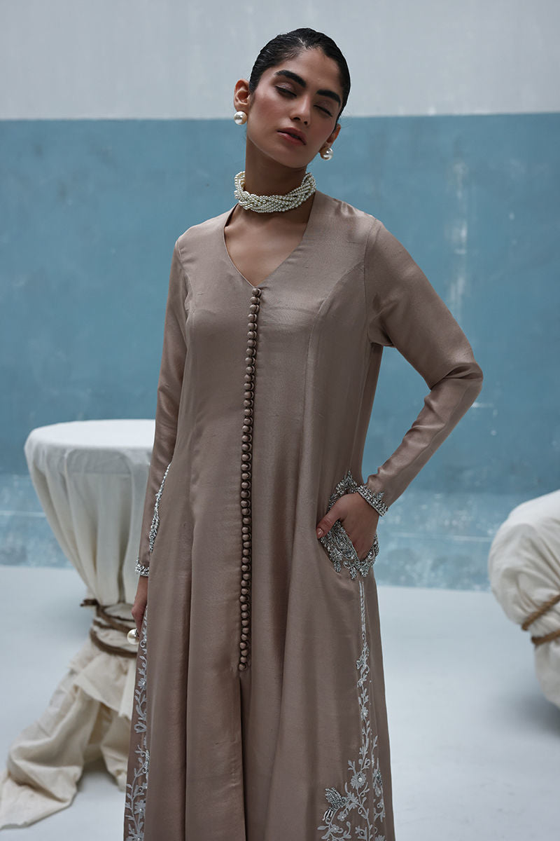 Ivory raw silk front-open embroidered shirt with pearls and cutdana, paired with shimmer crepe beige culottes – Pakistani formal outfit for weddings and events.