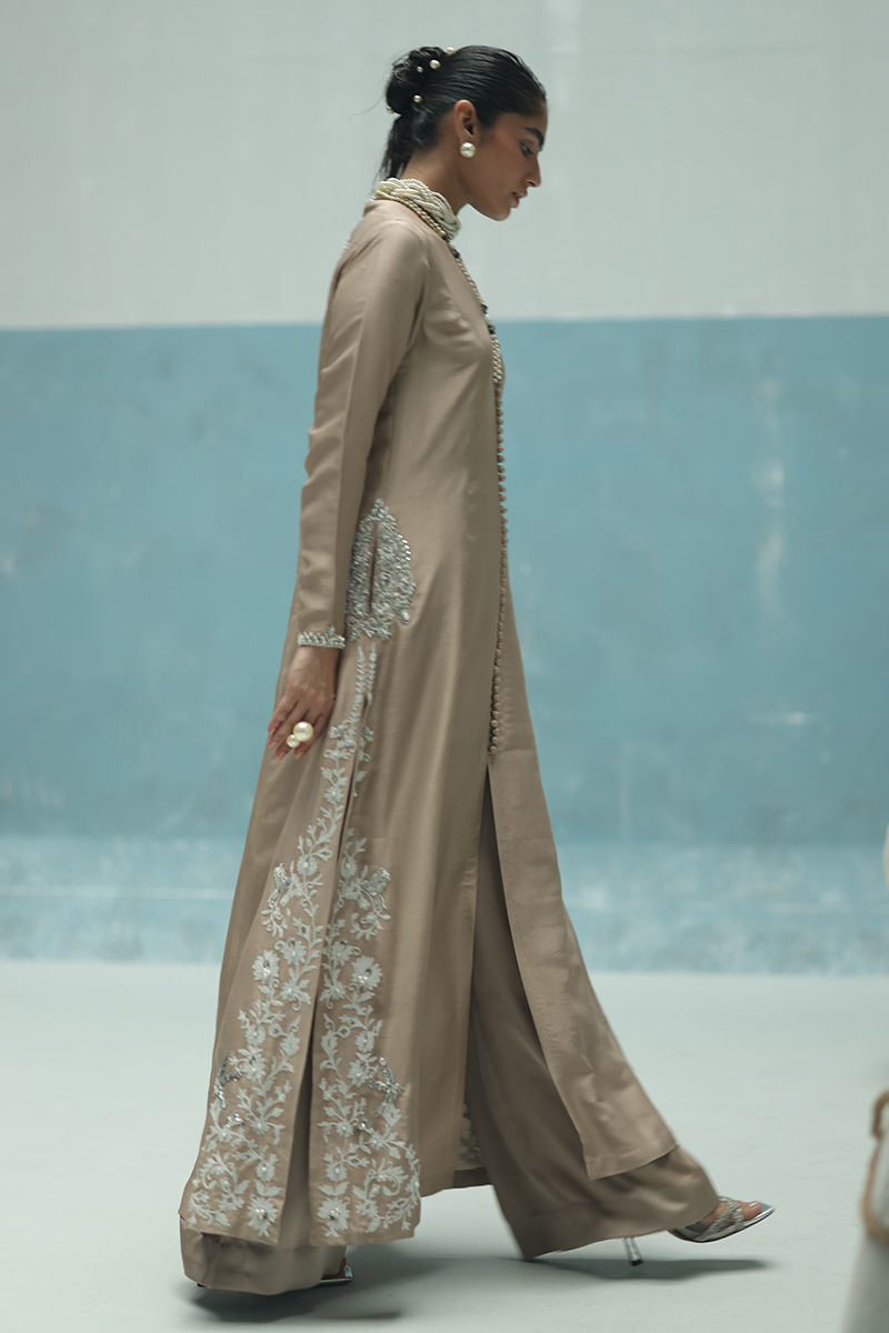 Ivory raw silk front-open embroidered shirt with pearls and cutdana, paired with shimmer crepe beige culottes – Pakistani formal outfit for weddings and events.