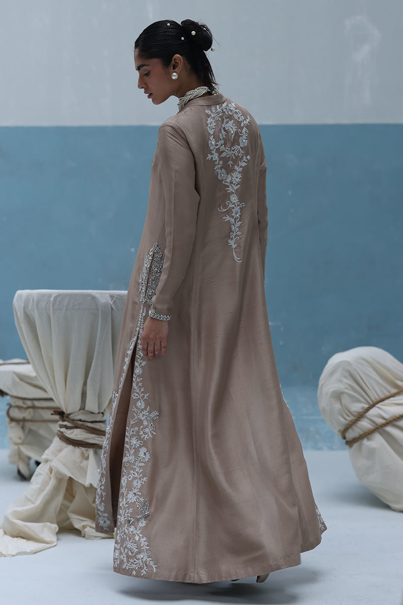 Ivory raw silk front-open embroidered shirt with pearls and cutdana, paired with shimmer crepe beige culottes – Pakistani formal outfit for weddings and events.