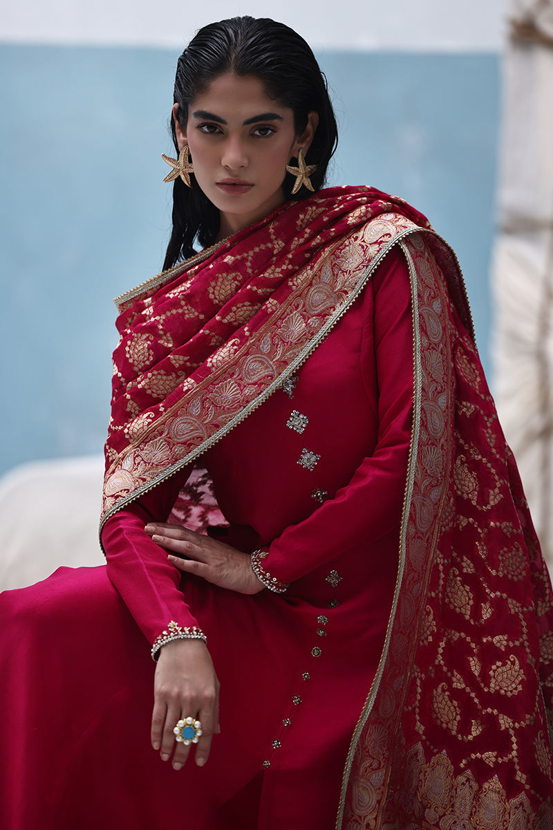 Persian red raw silk shirt with zardozi work, crepe culottes, and Banarsi chiffon dupatta – formal Pakistani suit for weddings and Eid.