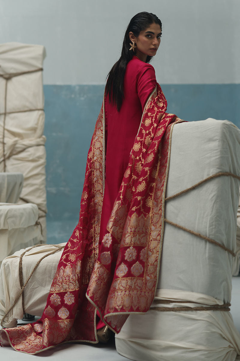 Persian red raw silk shirt with zardozi work, crepe culottes, and Banarsi chiffon dupatta – formal Pakistani suit for weddings and Eid.