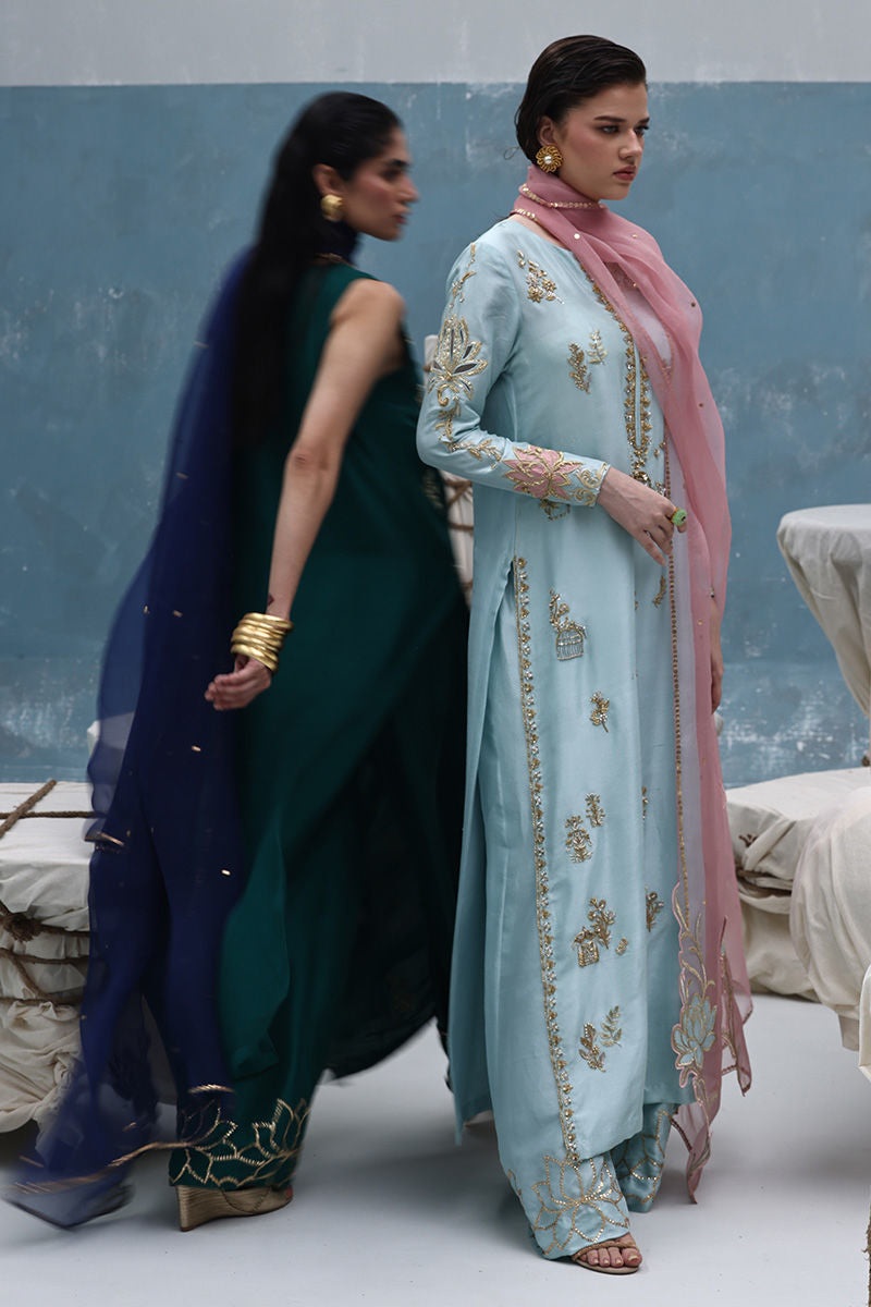 Antique green zardozi embroidered raw silk shirt with blue organza dupatta and embellished culottes – formal Pakistani outfit for women overseas.

