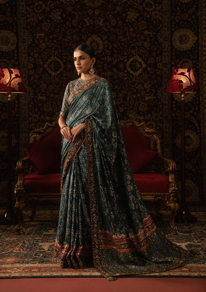Aik Sari Edit ’25 Look 05 – Pakistani designer teal embroidered silk saree stitched with blouse & petticoat, luxury outfit at Pakistanimoda.