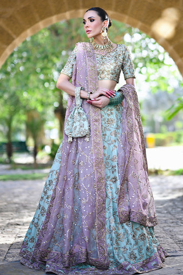 Dual-toned Pakistani bridal set in mauve and teal raw silk with Indian sleeves, gold pitta work, and mauve kamdani dupatta – perfect for brides in USA, UK, and Canada.