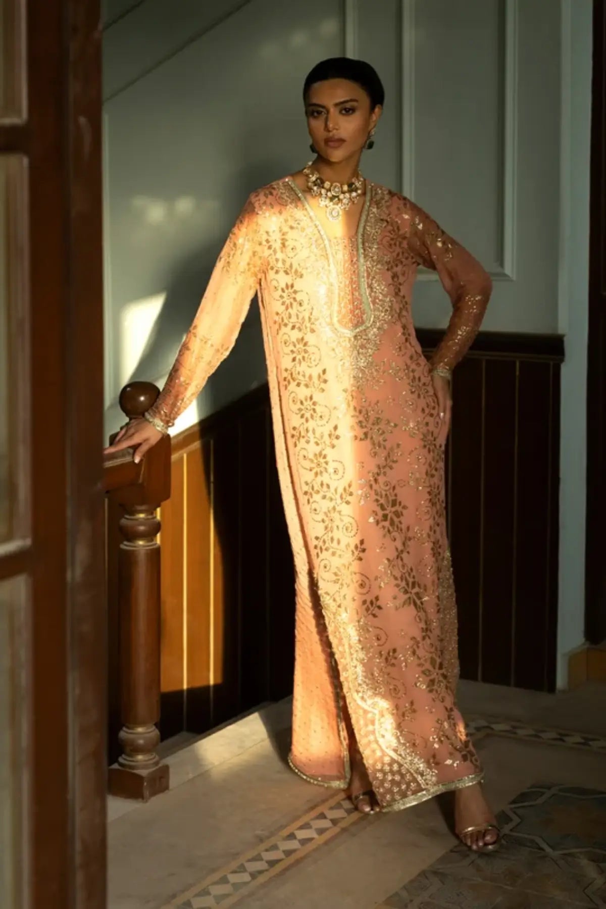 Seraphine peach Mukesh embroidered stitched formal kaftan with intricate Zardozi handwork and floral detailing
