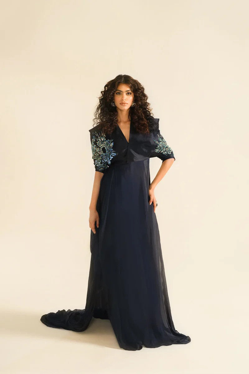 Midnight blue drape dress with crystal embellished sleeves and silk pants.