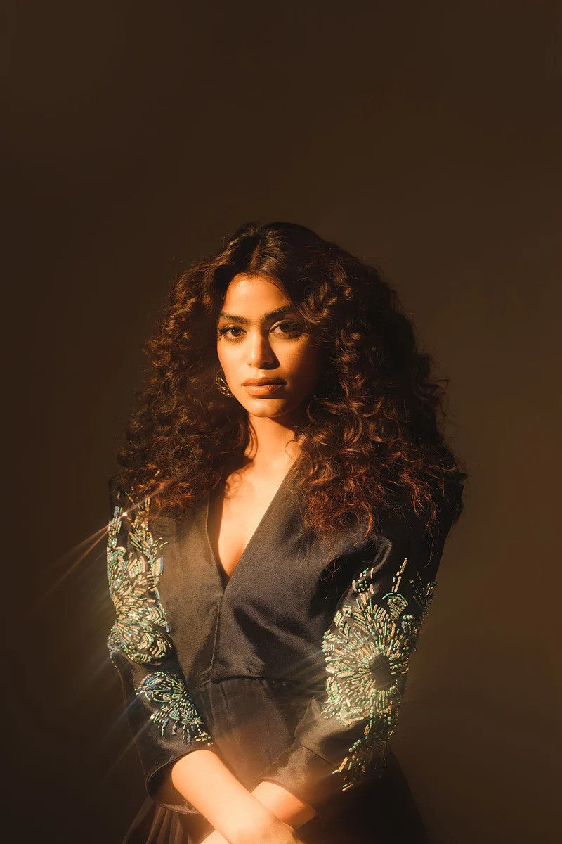 Midnight blue drape dress with crystal embellished sleeves and silk pants.