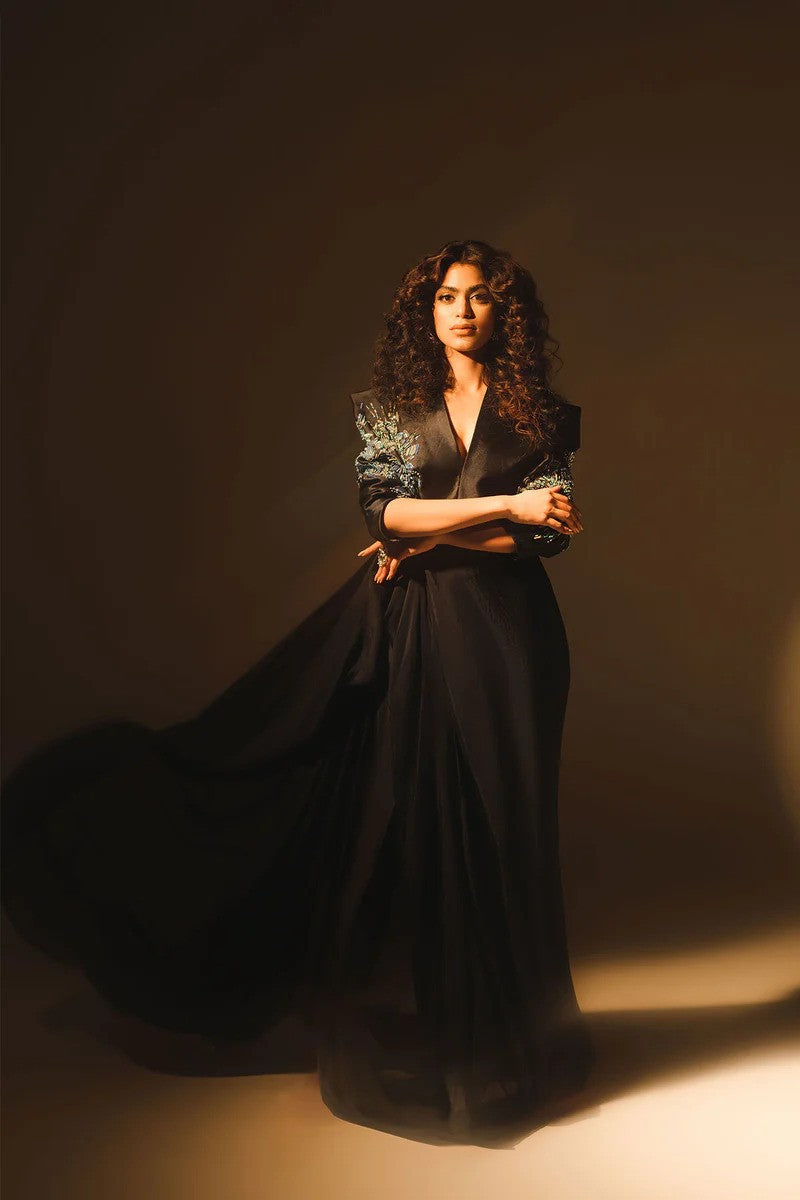 Midnight blue drape dress with crystal embellished sleeves and silk pants.