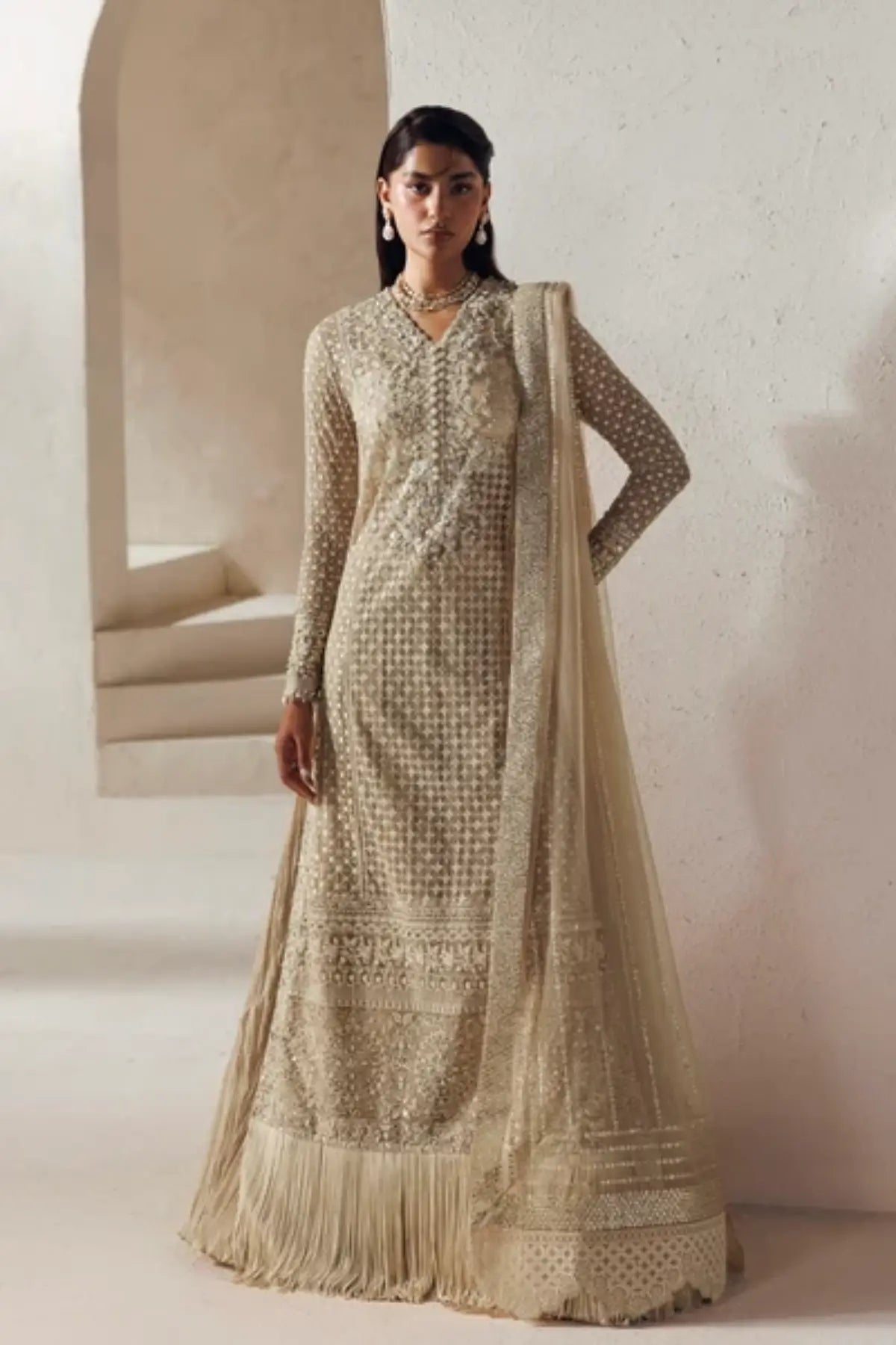 Sevilla Modern Muse 26 champagne gold net Nikkah stitched sharara suit with hand embellishment, silk sharara and embroidered net dupatta