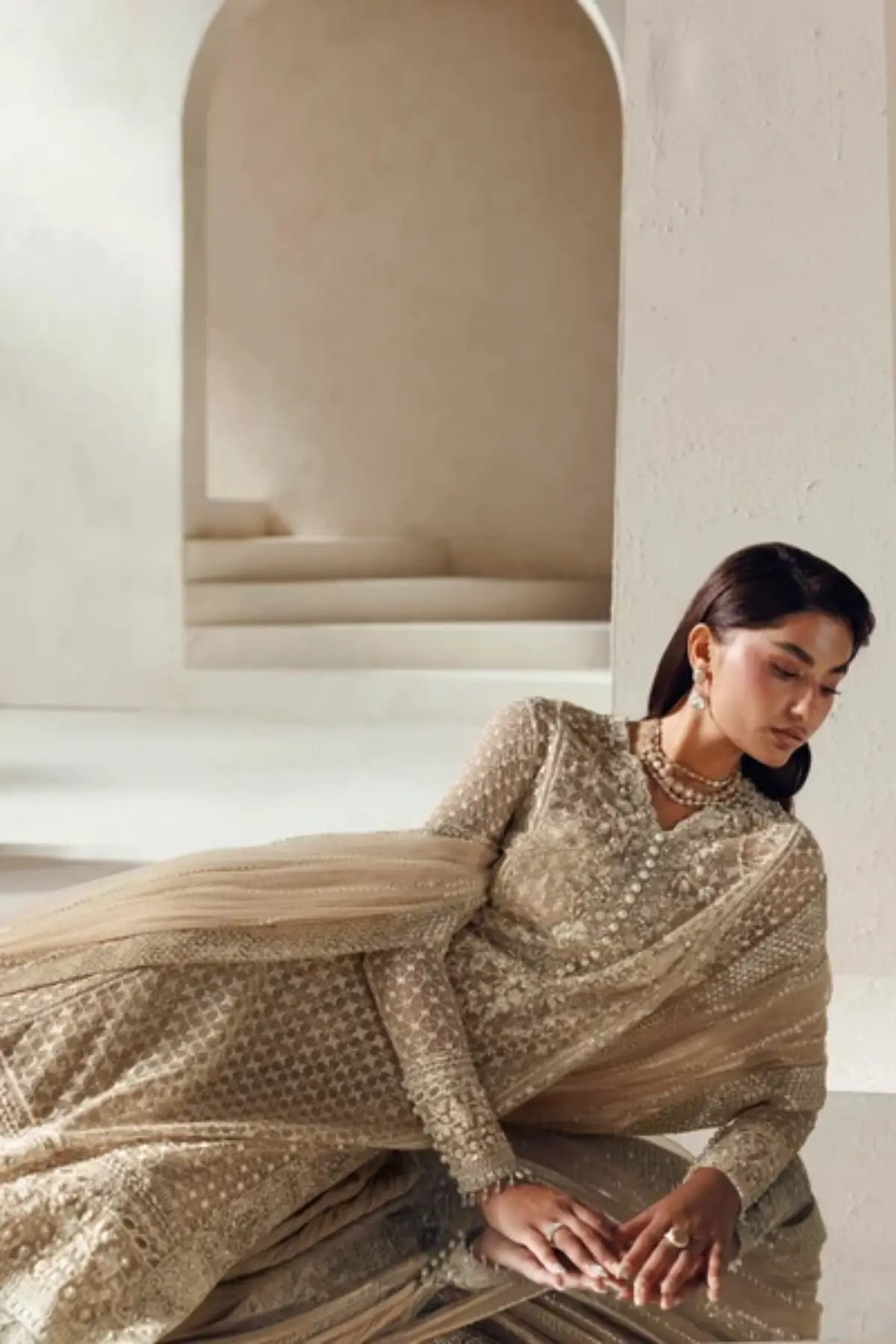 Sevilla Modern Muse 26 champagne gold net Nikkah stitched sharara suit with hand embellishment, silk sharara and embroidered net dupatta
