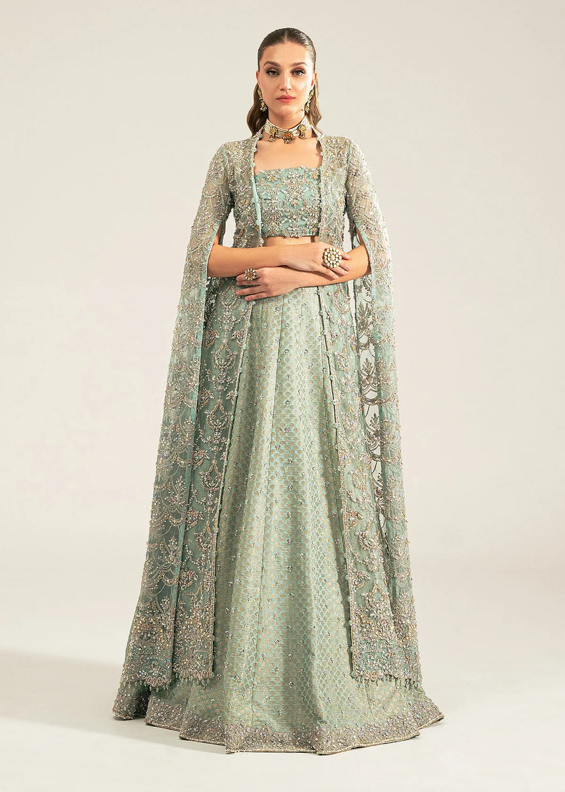 Shafaq by Kanwal Malik stitched bridal outfit in ice blue with hand-embellished organza shirt, bustier, and Jamavar lehenga – formal wear for weddings abroad.

