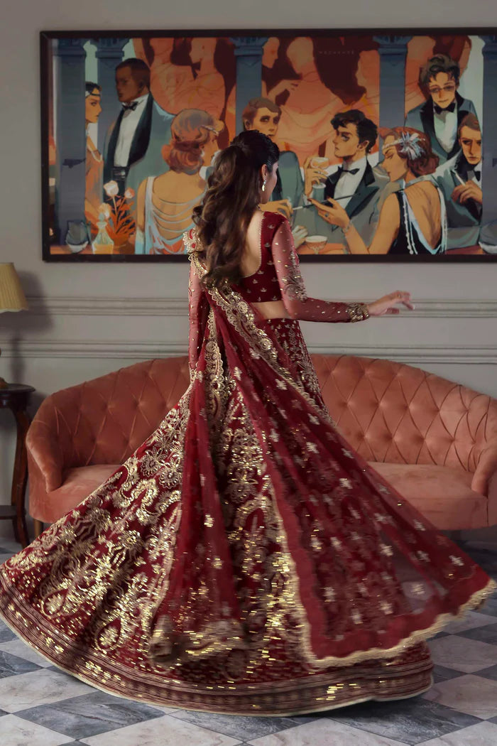 Shahbano regal maroon net bridal lehenga choli with embroidered dupatta by Akbar Aslam, luxury wedding couture for Pakistani brides.