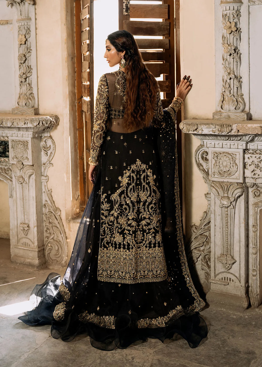 Shahtaj black stitched lehenga set by Kanwal Malik with ruffled organza lehenga, hand-embellished open shirt, bustier, and matching sequin dupatta.
