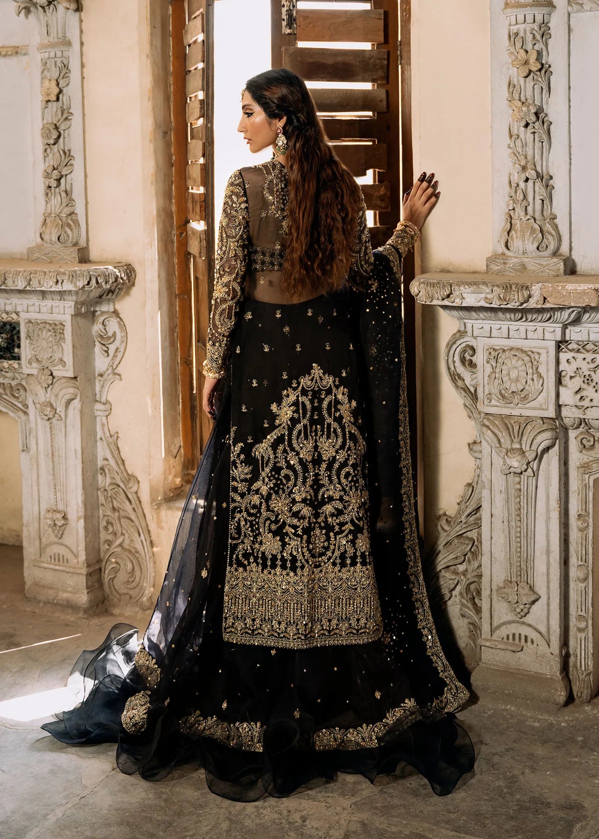 Shahtaj black stitched lehenga set by Kanwal Malik with ruffled organza lehenga, hand-embellished open shirt, bustier, and matching sequin dupatta.