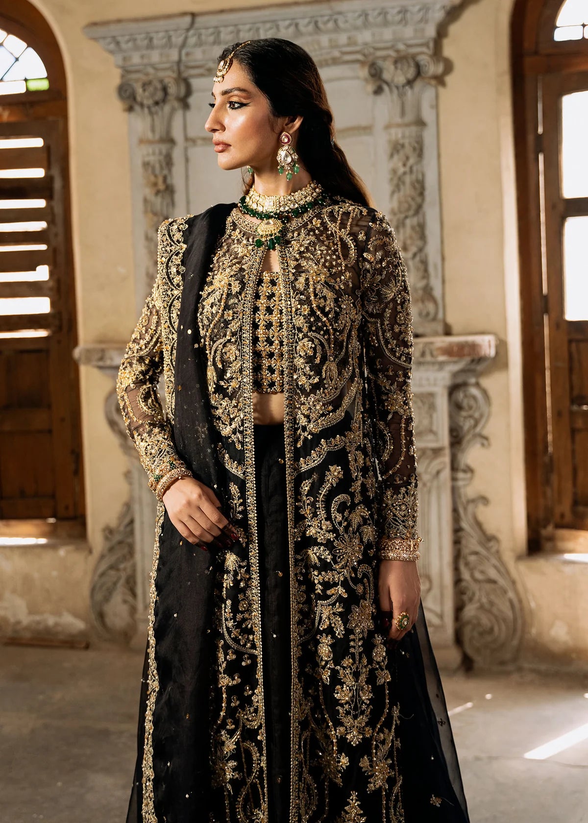 Shahtaj black stitched lehenga set by Kanwal Malik with ruffled organza lehenga, hand-embellished open shirt, bustier, and matching sequin dupatta.