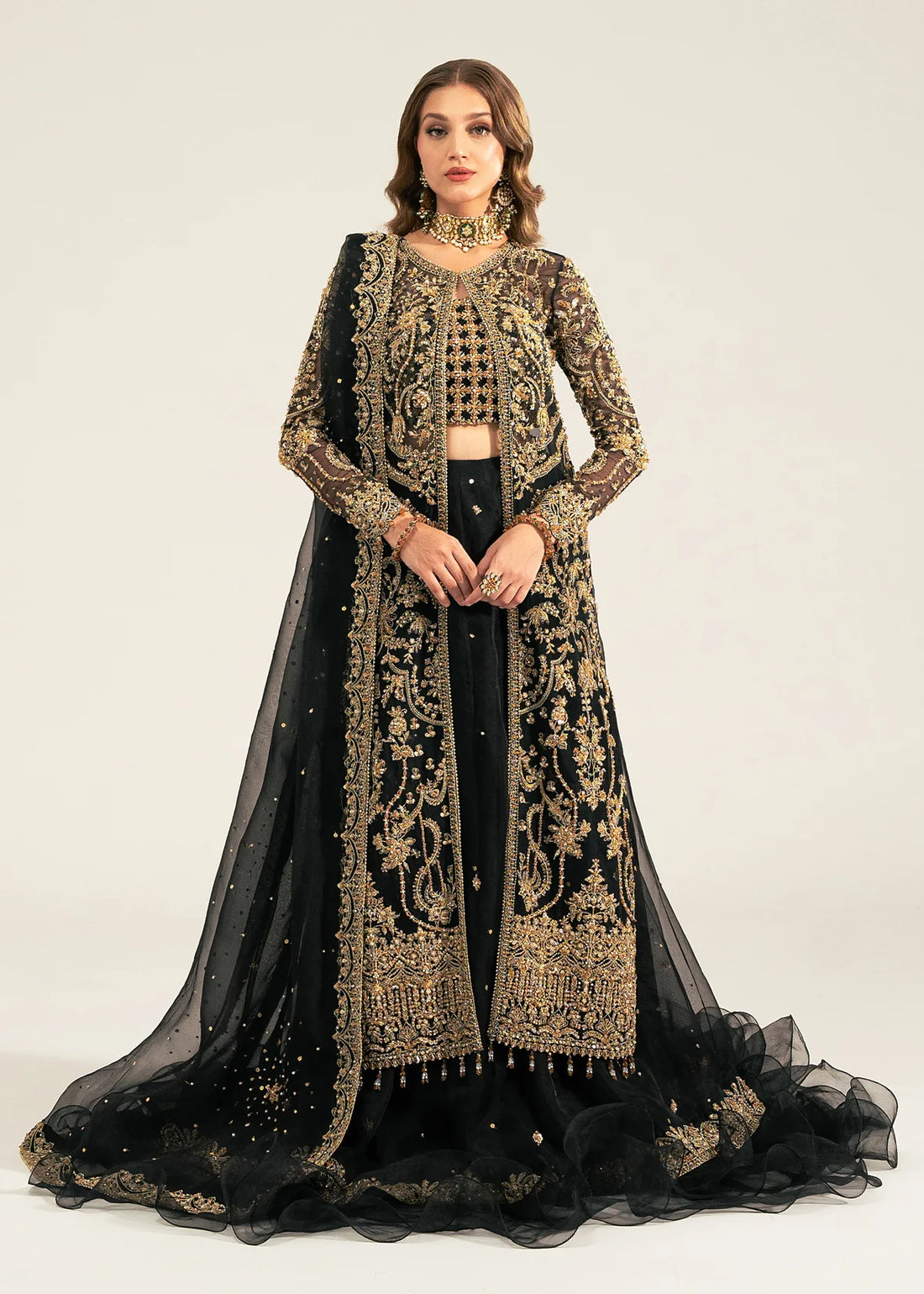 Shahtaj black stitched lehenga set by Kanwal Malik with ruffled organza lehenga, hand-embellished open shirt, bustier, and matching sequin dupatta.