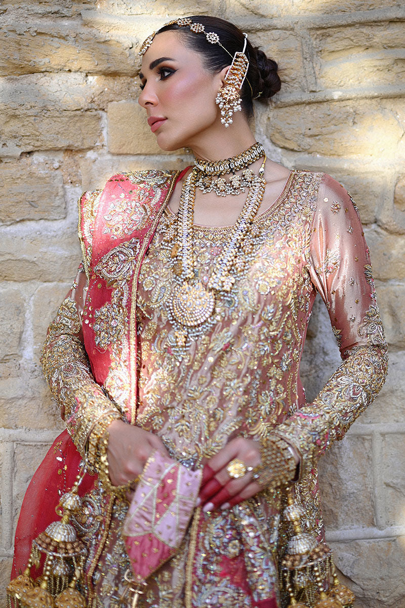 Watermelon pink Pakistani bridal farshi set with Swarovski and traditional handwork, paired with an organza net kamdani dupatta – ideal for brides in USA, UK, and Canada.