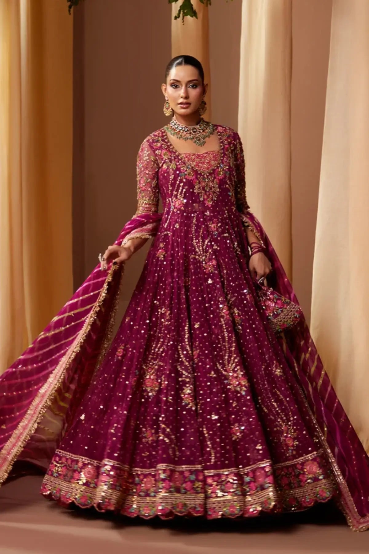 Shazdeh Deep Magenta Net Pakistani Wedding Pishwas with Gold Multicolor Embroidery, Cotton Jamawar Dhaka Pants, Striped Chiffon Dupatta and Embellished Pouch