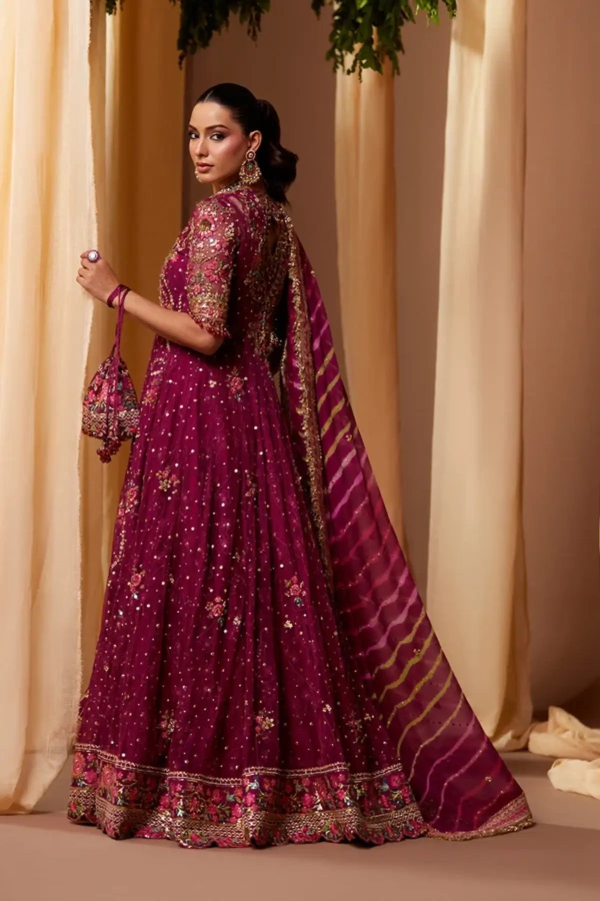 Shazdeh Deep Magenta Net Pakistani Wedding Pishwas with Gold Multicolor Embroidery, Cotton Jamawar Dhaka Pants, Striped Chiffon Dupatta and Embellished Pouch
