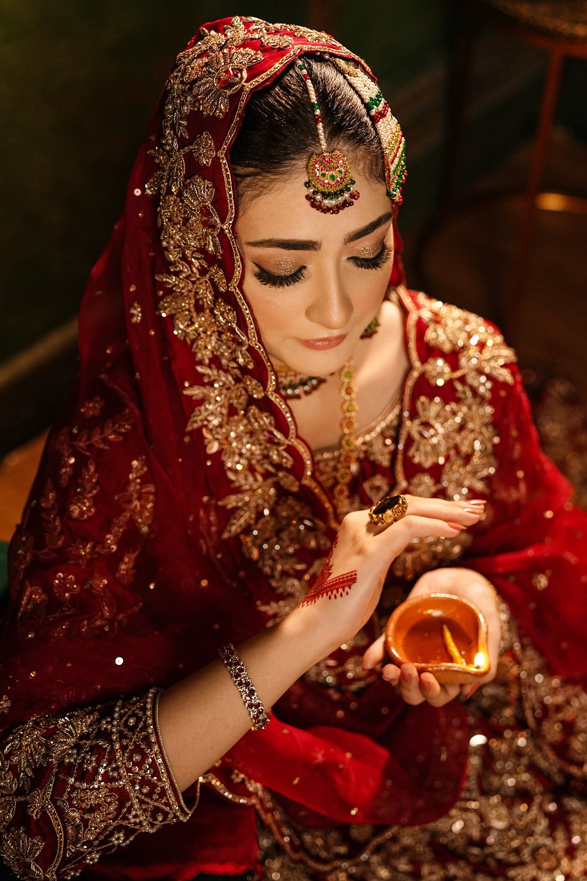 Shehrbano deep red Tassel Silk Pakistani bridal lehenga choli with gold handwork and organza dupatta by MariamRaj