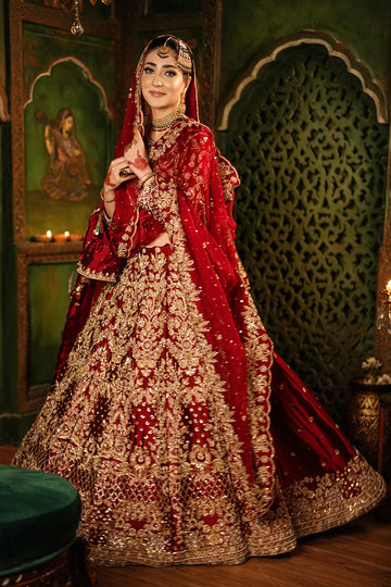 Shehrbano deep red Tassel Silk Pakistani bridal lehenga choli with gold handwork and organza dupatta by MariamRaj