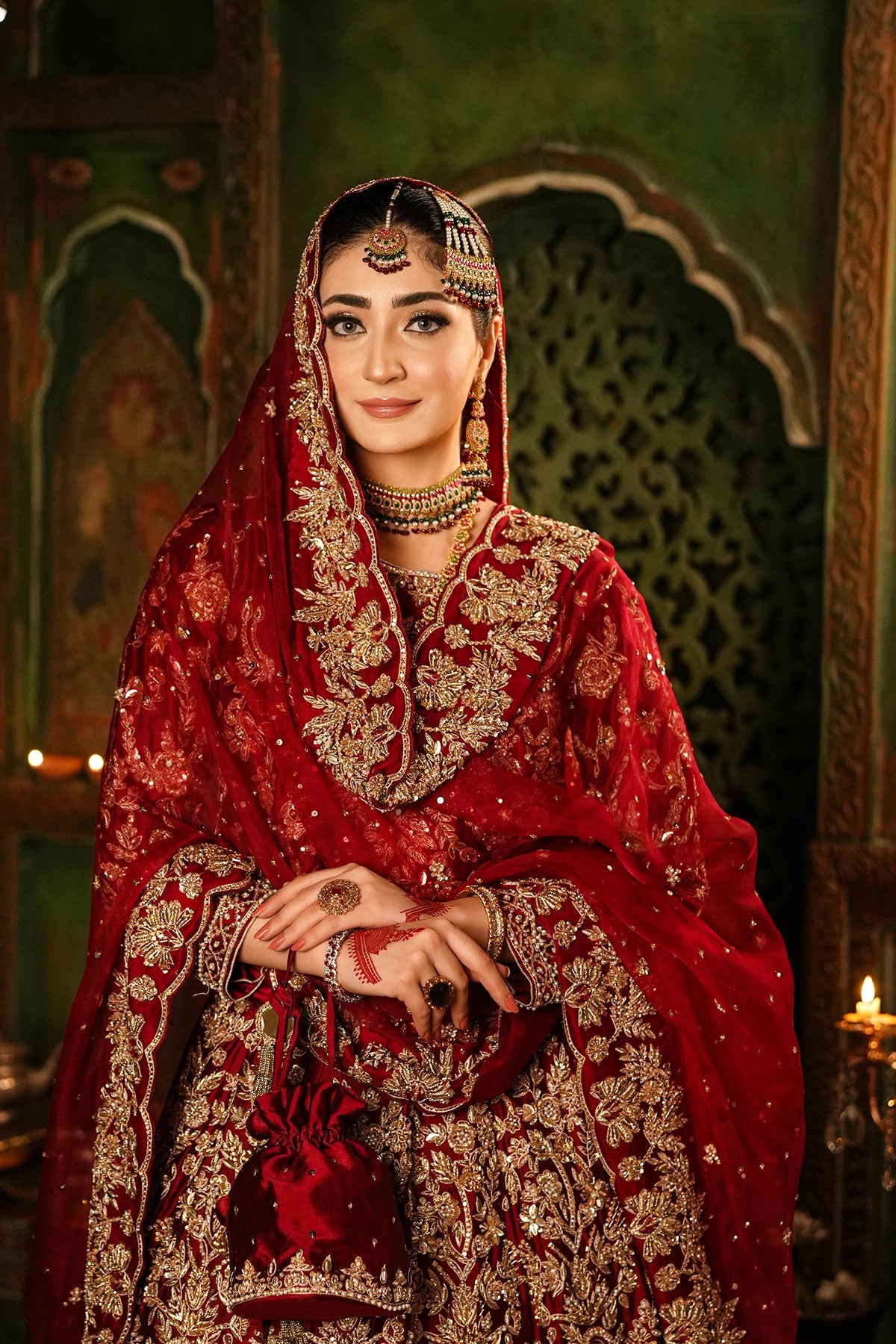 Shehrbano deep red Tassel Silk Pakistani bridal lehenga choli with gold handwork and organza dupatta by MariamRaj