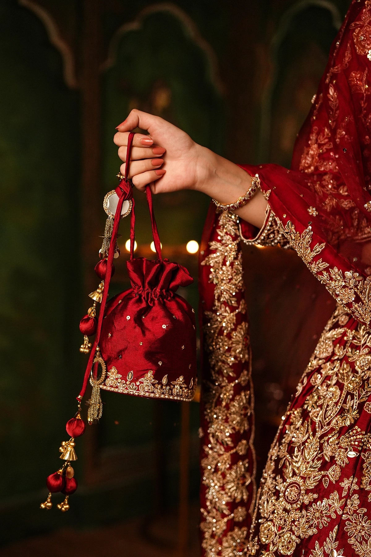 Shehrbano deep red Tassel Silk Pakistani bridal lehenga choli with gold handwork and organza dupatta by MariamRaj