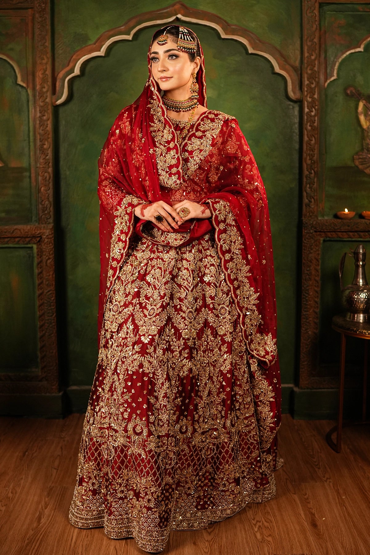 Shehrbano deep red Tassel Silk Pakistani bridal lehenga choli with gold handwork and organza dupatta by MariamRaj