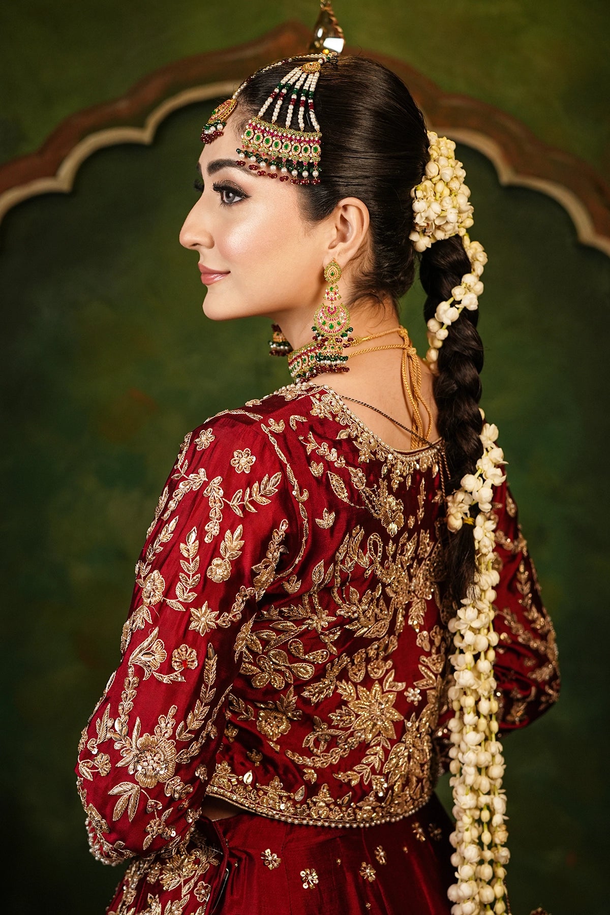 Shehrbano deep red Tassel Silk Pakistani bridal lehenga choli with gold handwork and organza dupatta by MariamRaj